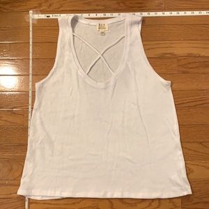 Simple white tank with crisscrossed neck line detail